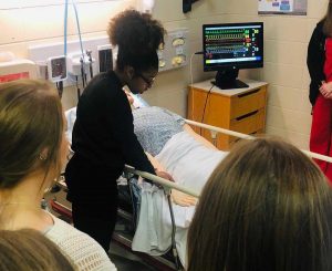 A student participating in a lab during a visit to UMMC