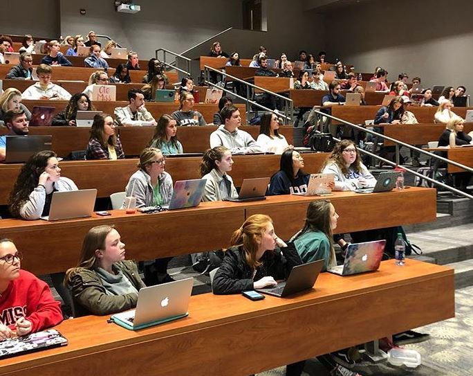 A group of students attending class in preparation for the application process