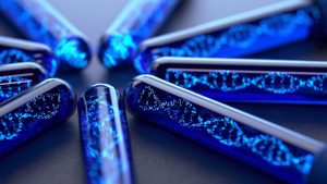 close-up image of test tubes with an image of the DNA strands inside