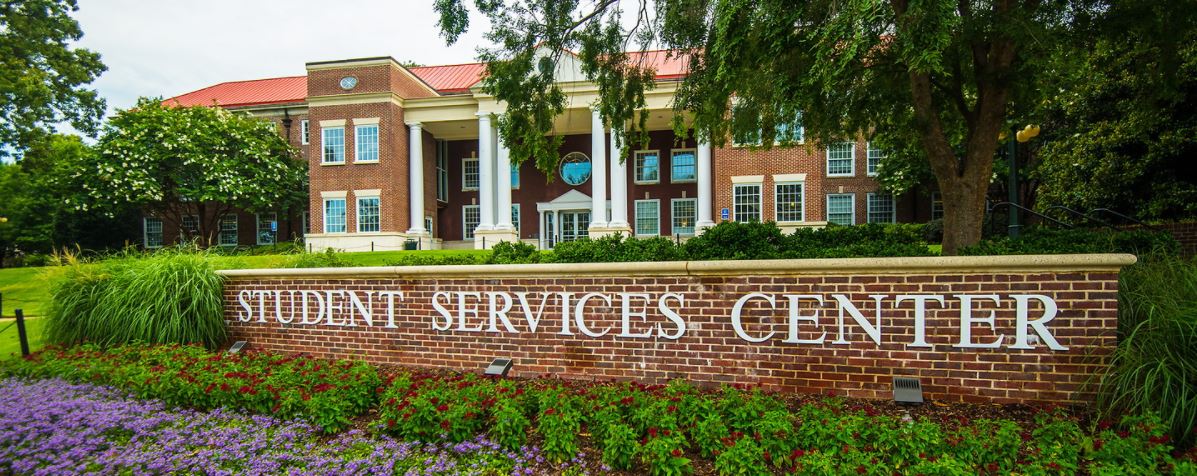 Martindale Hall, with the Student Services Center sign in the foreground